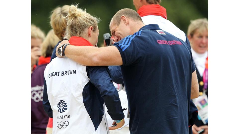 Mike Tindall puts arm around wife Zara after she wins silver medal