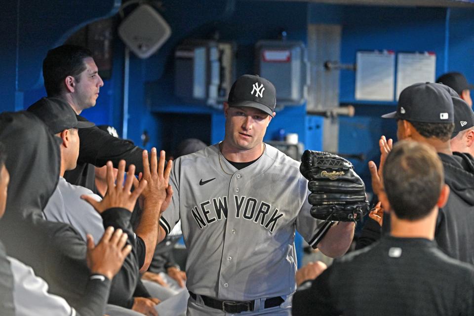 May 17, 2023; Toronto, Ontario, CAN;  New York Yankees pitcher Gerrit Cole (45) is greeted by teammates in the dugout against the Toronto Blue Jays at Rogers Centre. Mandatory Credit: Dan Hamilton-USA TODAY Sports