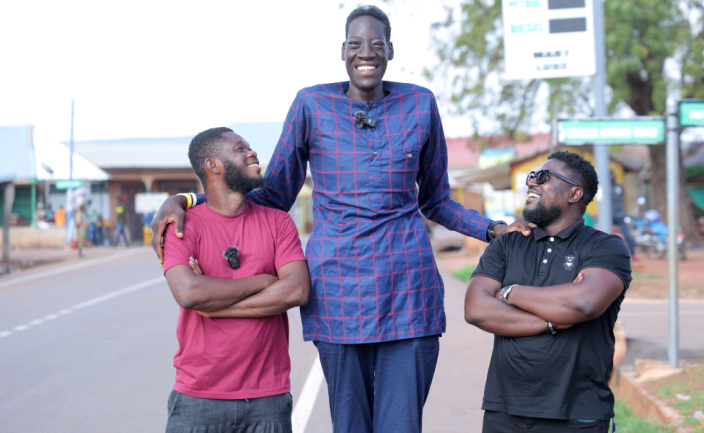 Awuche pictured between two BBC employees