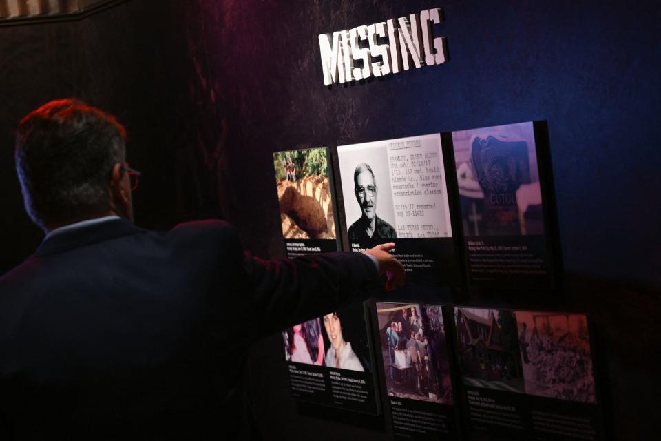 Geoff Schumacher, vice president of exhibits and programs of The Mob Museum, the National Museum of Organized Crime and Law Enforcement, points during an interview about the museum's exhibits and the history of organized crime murders and missing people on June 29, 2022 in Las Vegas. / Credit: PATRICK T. FALLON/AFP via Getty Images