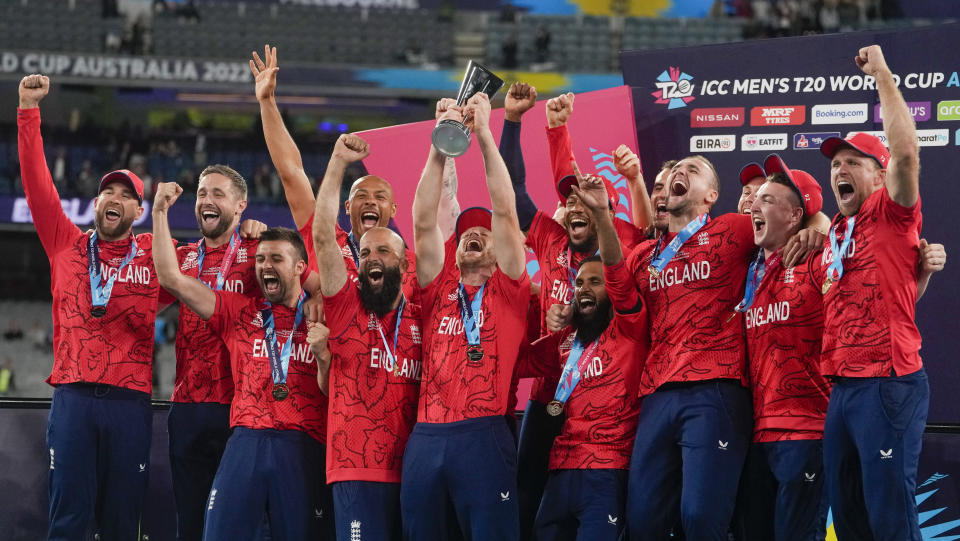 FILE - England celebrate with their trophy after defeating Pakistan in the final of the T20 World Cup cricket at the Melbourne Cricket Ground in Melbourne, Australia, Sunday, Nov. 13, 2022. The return of fast bowler Jofra Archer has boosted England's chances of becoming the first team to win consecutive Twenty20 World Cups.(AP Photo/Mark Baker, File)