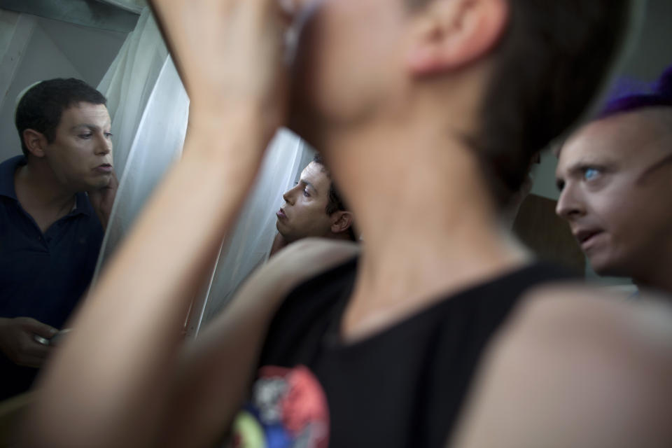 In this photo taken on Tuesday, June 18, 2013, Israeli Orthodox Jew Shahar Hadar puts on makeup as he prepares for a show at a drag queen school in downtown Tel Aviv, Israel. Hadar, a telemarketer by day, has taken the gay Orthodox struggle from the synagogue to the stage, beginning to perform as one of Israel’s few religious drag queens. His drag persona is that of a rebbetzin, a female rabbinic advisor, a wholesome guise that stands out among the sarcastic and raunchy cast of characters on Israel’s drag queen circuit. (AP Photo/Oded Balilty)