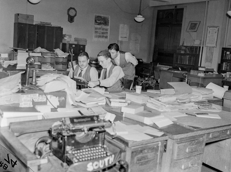 Associated Press editors are look over stories on election night, Nov. 8, 1938, in Washington, D.C. (AP Photo)