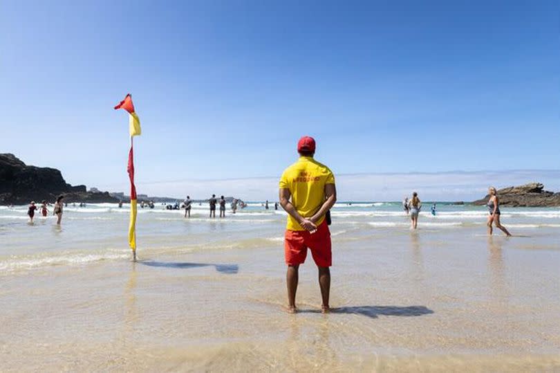 Two panicked children were rescued after getting swept out by the river on Porth beach