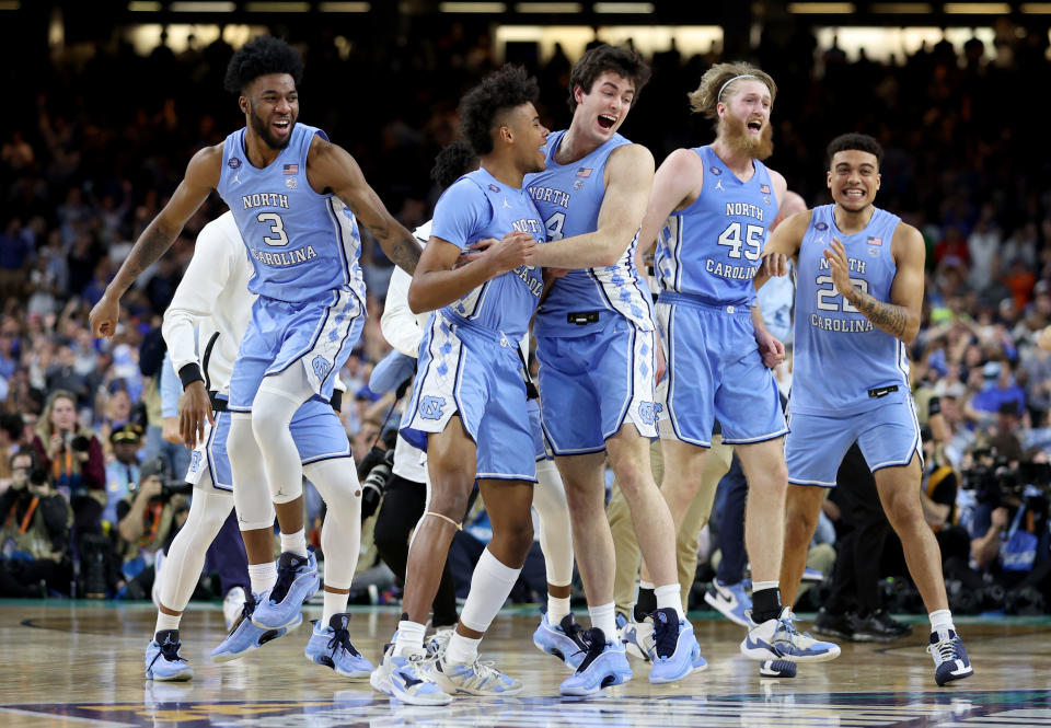 North Carolina Tar Heels players react after defeating the Duke Blue Devils 81-77 in the Final Four on Saturday. (Jamie Squire/Getty Images)