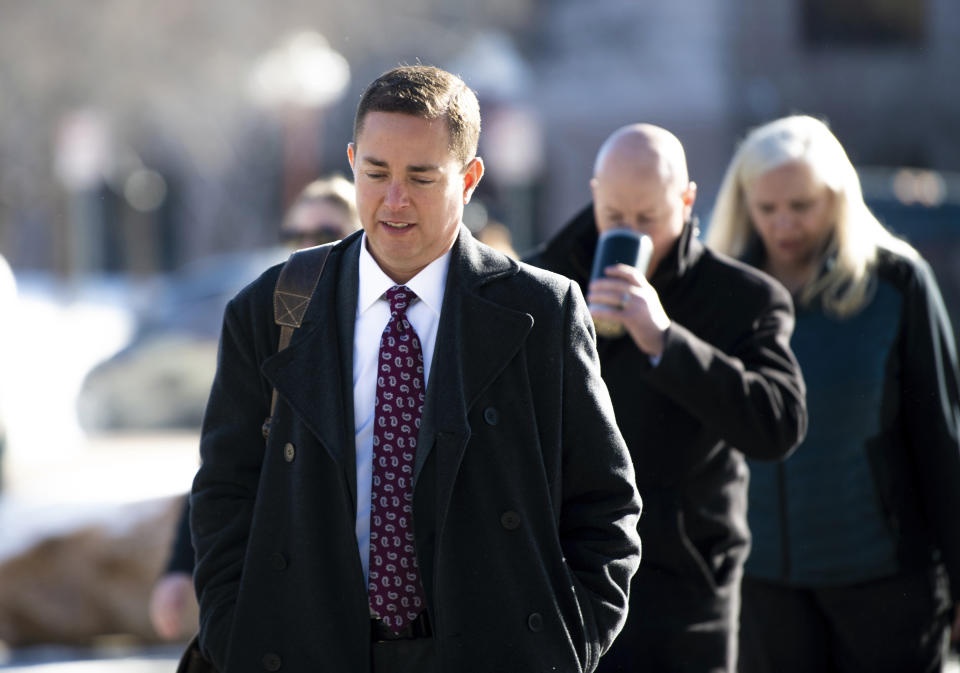 Michael J. Allen, front, district attorney for Colorado's Fourth Judicial District, arrives at the El Paso County courthouse for the second and final day of a preliminary hearing for the alleged shooter in the Club Q mass shooting Thursday, Feb. 23, 2023, in Colorado Springs, Colo. Judge Michael McHenry ruled that alleged shooter Anderson Aldrich will face a jury trial. (Parker Seibold /The Gazette via AP)