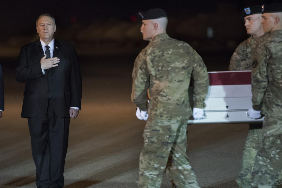 An Army carry team moves a transfer case containing the remains of Sgt. 1st Class Elis Barreto Ortiz, 34, from Morovis, Puerto Rico, past Secretary of State Mike Pompeo, Saturday, Sept. 7, 2019, at Dover Air Force Base, Del. According to the Department of Defense, Ortiz was killed in action Sept. 5, when a vehicle-borne improvised explosive device detonated near his vehicle in Kabul, Afghanistan. Ortiz was supporting Operation Freedom's Sentinel. (AP Photo/Cliff Owen)