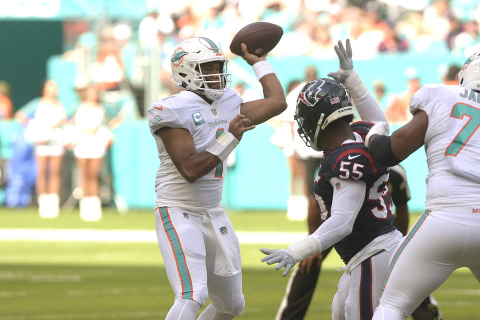 Miami Dolphins quarterback Tua Tagovailoa (1) aims a pass during the first half of an NFL football game against the Houston Texans, Sunday, Nov. 27, 2022, in Miami Gardens, Fla. (AP Photo/Michael Laughlin)