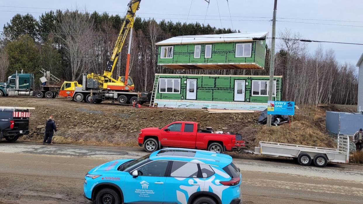 The new modular houses from Habitat for Humanity shown here being put together in Miramichi.  (Submitted by Perry Kendall - image credit)