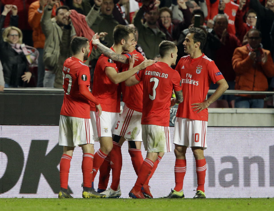 Benfica's Francisco Ferreira, second left, celebrates with teammates after scoring his side's second goal during the Europa League round of 16, second leg, soccer match between Benfica and Dinamo Zagreb at the Luz stadium in Lisbon, Thursday, March 14, 2019. (AP Photo/Armando Franca)