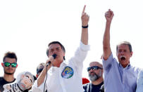 Presidential candidate Jair Bolsonaro (L) and Paulo Chagas, retired General of the Brazilian Army, attend a rally in Taguatinga near Brasilia, Brazil September 5, 2018. Picture taken September 5, 2018. REUTERS/Adriano Machado