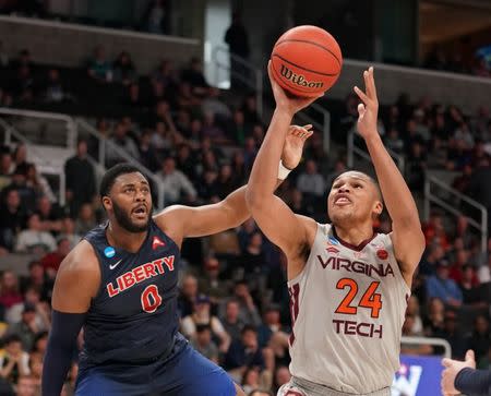 Mar 24, 2019; San Jose, CA, USA; Virginia Tech Hokies forward Kerry Blackshear Jr. (24) shoots against Liberty Flames forward Myo Baxter-Bell (0) during the first half in the second round of the 2019 NCAA Tournament at SAP Center. Mandatory Credit: Kyle Terada-USA TODAY Sports