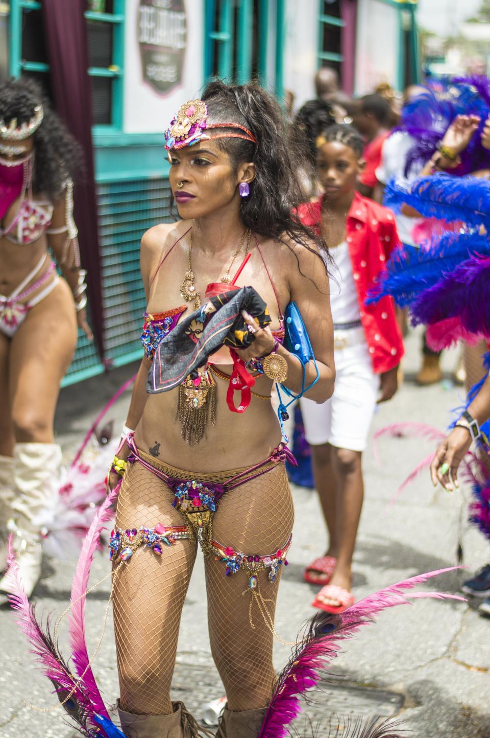 Crop Over seriously isn't for the shy. Her barely-there top and bottom feature a medley of royal blue, pinks, and jewel tones. Along with the matching accessories, this look is truly a work of art.