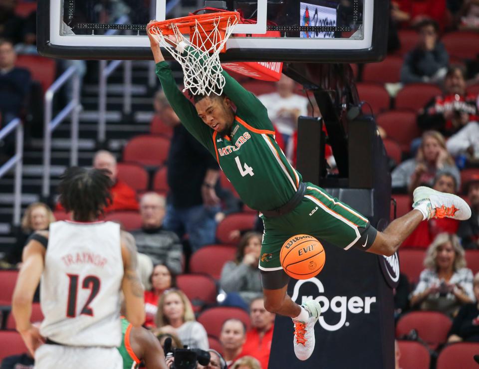 Florida A&M's Hantz Louis-Jeune jams down to against a lagging Louisville defense in the first half at the YUM! Center in Downtown Louisville Saturday. Dec. 17, 2022 