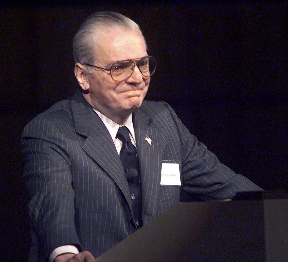 Former Corning Inc. Chairman and CEO James R. Houghton, accepts applause from shareholders at the conclusion of the 2002 annual meeting in Corning.