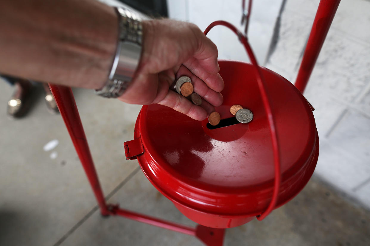 Lt. Christopher White, Corps Officer with the Salvation Army was shocked to find out that someone put a valuable rare coin in his red bucket. (Photo by Joe Raedle/Getty Images)