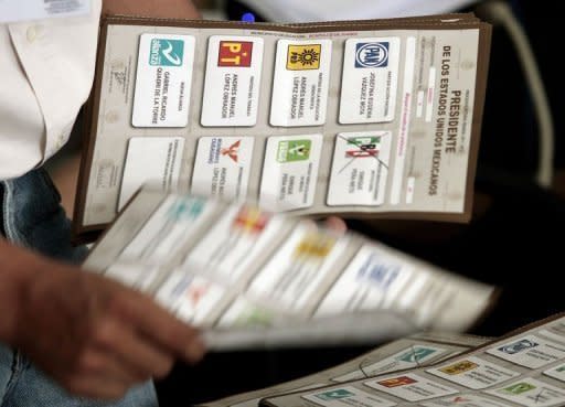 An employee of the Federal Electoral Institute (IFE) counts votes in Acapulco, Guerrero state, Mexico. Mexico's national election authority Wednesday announced a recount of ballots cast at more than half of the polling stations in the country's weekend presidential election in which Enrique Pena Nieto claimed victory