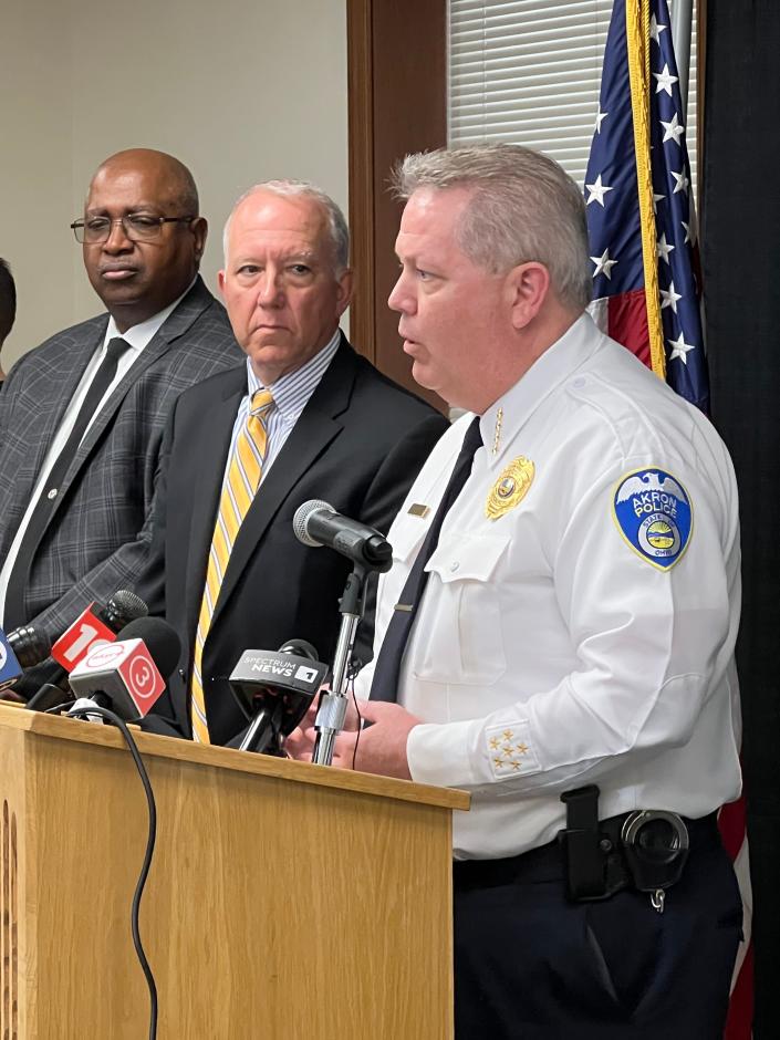 Akron Police Chief Steve Mylett addresses the media during a press conference Monday following the grand jury decision in the Jayland Walker case as Deputy Mayor for Public Safety Clarence Tucker (left) and Mayor Dan Horrigan listen.