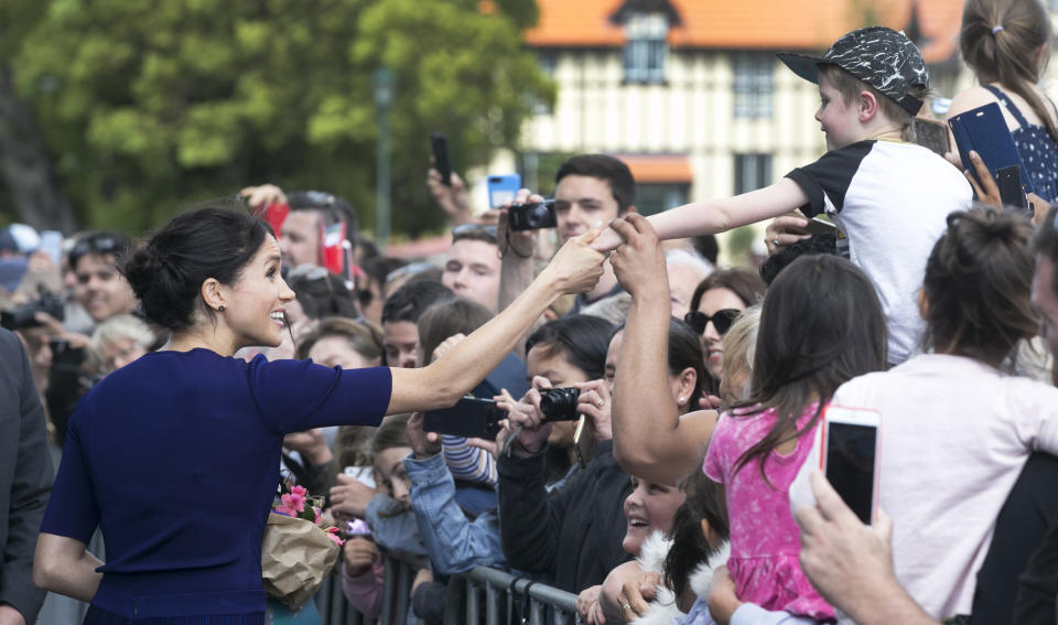 The Duchess of Sussex is used to charming crowds.  (Photo: Pool via Getty Images)