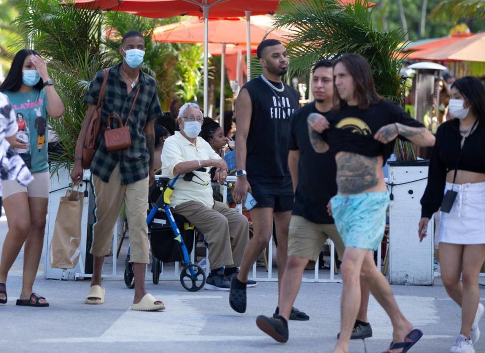 Despite the coronavirus, spring breakers return to South Beach as Jose Ramirez, 80, of Chicago, watches the activity pass by while sitting on his walker along Ocean Drive on Thursday, March 12, 2021.