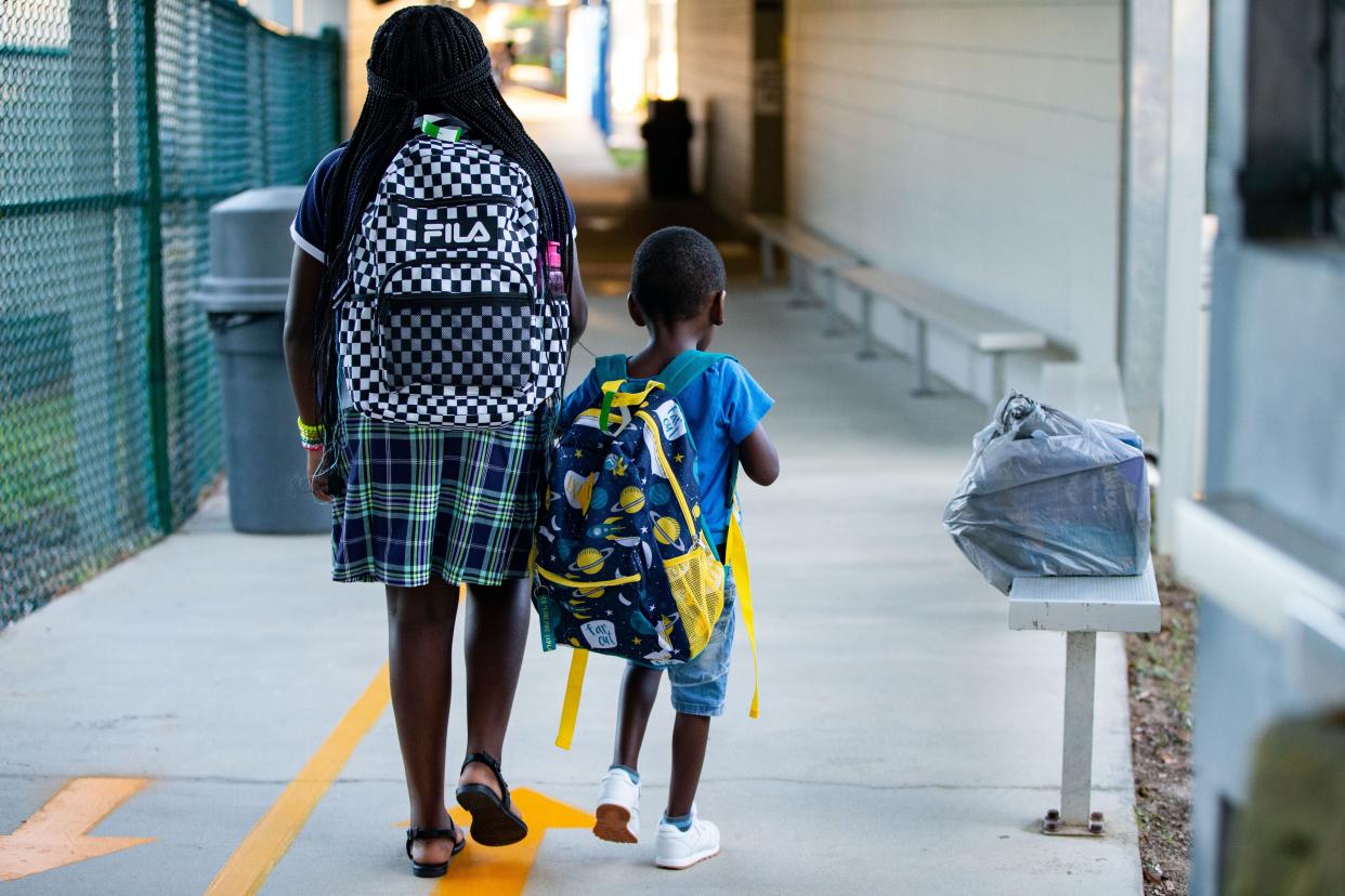 Students at Sabal Palm Elementary School make their way through the halls to get to their classrooms on the first day of school Thursday, Aug. 10, 2023. 