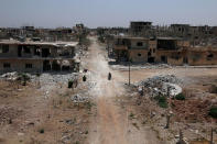 <p>Damaged buildings are seen through a window a the rebel-held area in Deraa, Syria July 27, 2017. (Photo: Alaa al-Faqir/Reuters) </p>