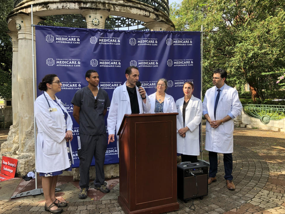 Rob Davidson speaks at a rally with doctors who converged at the Texas Medical Center to denounce what they call President Trump’s “assault” on Americans’ health care. (Photo: Alexander Nazaryan/Yahoo News)