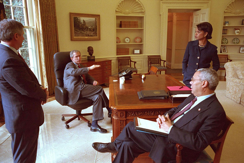 President George W. Bush meets with Chief of Staff Andy Card, Secretary of State Colin Powell, and National Security Advisor Condoleezza Rice in the Oval Office, 2001.<span class="copyright">Eric Draper—White House/Getty Images</span>