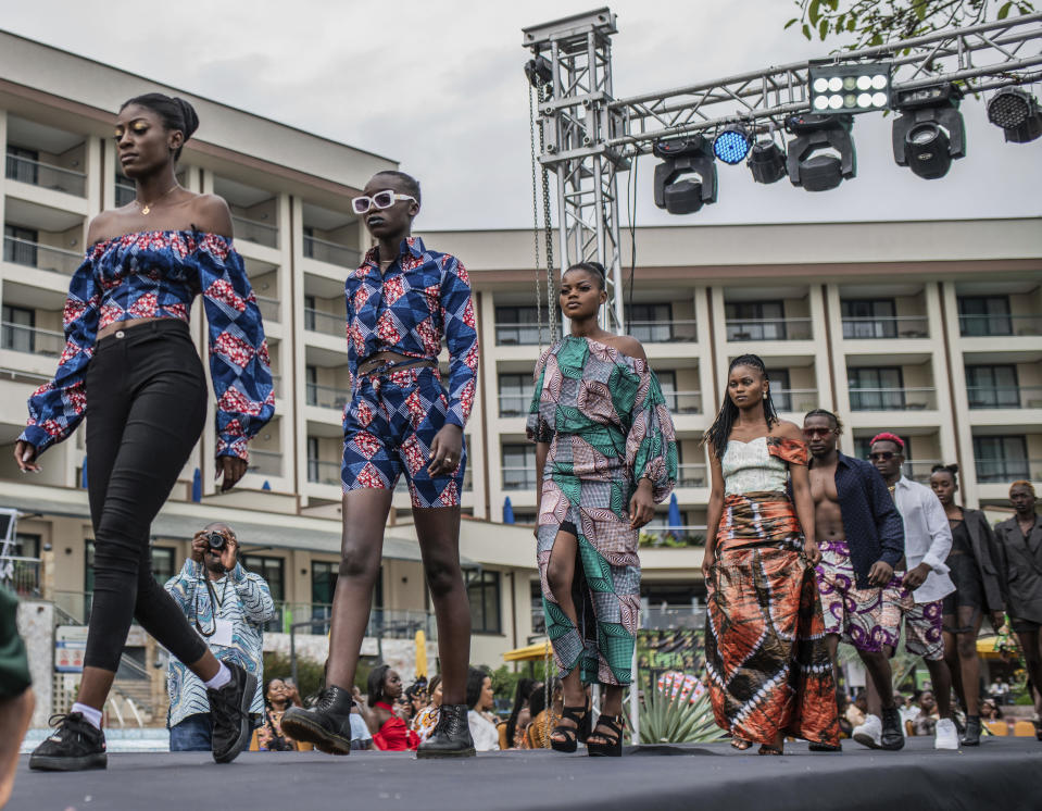 Models present dresses during the ninth edition of the Liputa fashion show in Goma, Democratic Republic of Congo, Saturday June 24, 2023. The objective of the show, involving designers, models and artists from DRC, Cameroon, Central African Republic, Senegal, Burundi, France, United States and others, is to reveal the latest trends, but also to deliver a message of peace and peaceful coexistence during a period of high tension between the DRC and Rwanda, accused by Kinshasa of supporting the M23 rebellion in the east of country. (AP Photo/Moses Sawasawa)