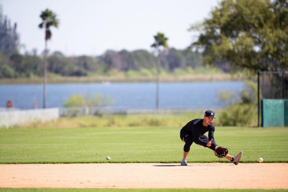 Tigers infield prospect Zack Short fields a ground ball during the workout at Joker Marchant Stadium in Lakeland, Florida, on Saturday, Feb. 20, 2021.