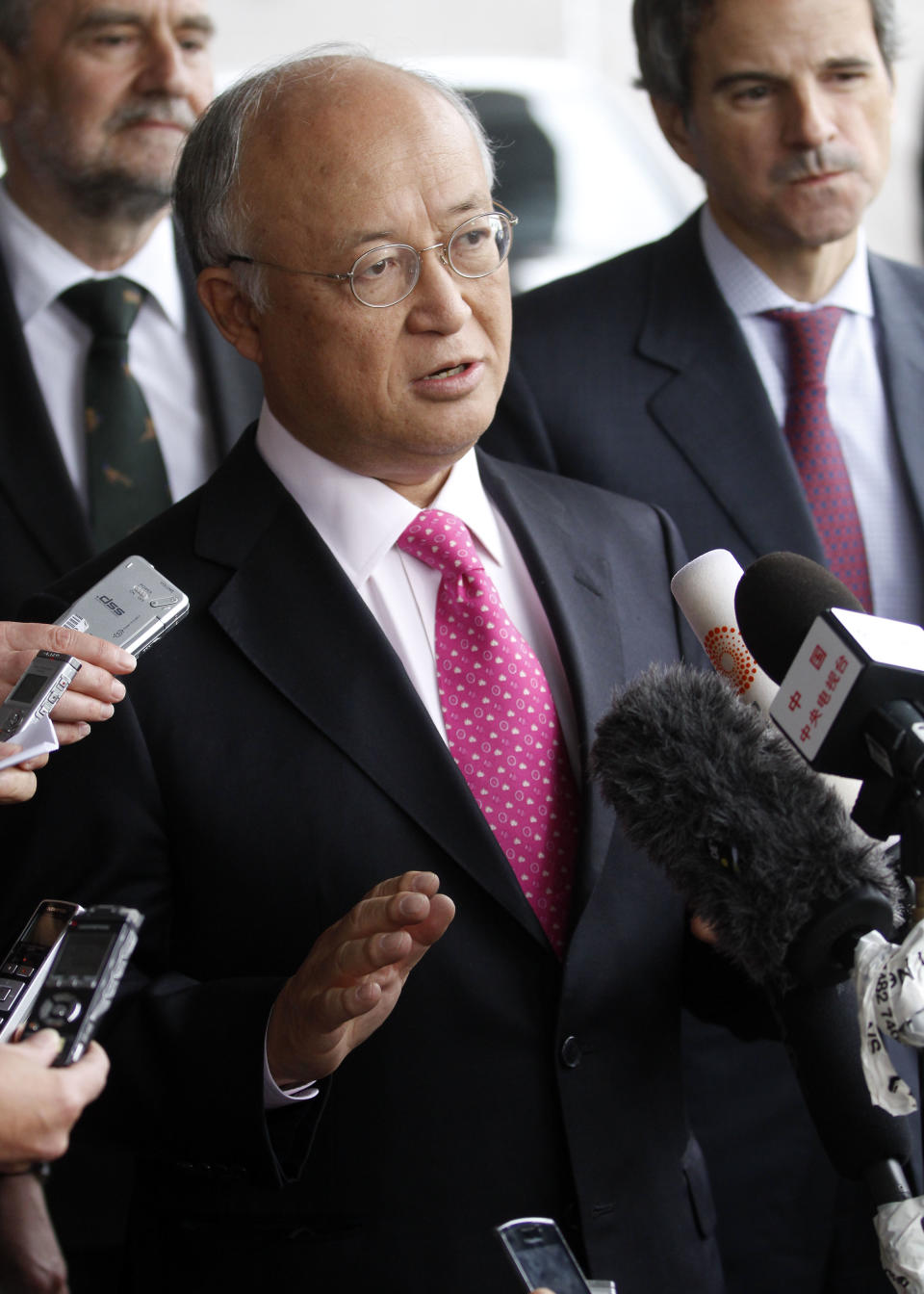 Director General of the International Atomic Energy Agency, IAEA, Yukiya Amano from Japan speaks to the media after returning from Iran at the Vienna International Airport near Schwechat, Austria, on Tuesday, May 22, 2012. Amano says he has reached a deal with Iran on probing suspected work on nuclear weapons and adds that the agreement will "be signed quite soon." (AP Photo/Ronald Zak)