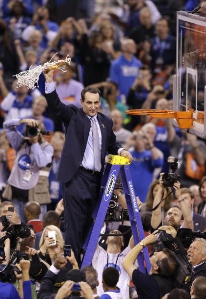 Mike Krzyzewski cuts down the net after his team&#39;s 68-63 victory over Wisconsin. (AP)