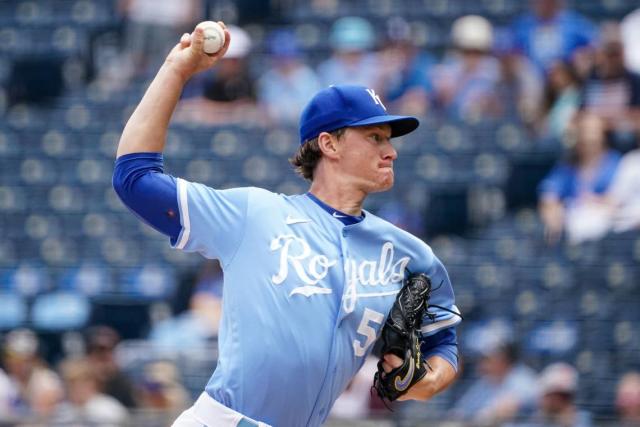 Kansas City Royals starting pitcher Brady Singer throws during the