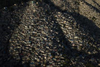 Homes stand densely packed in the Jalouise neighborhood of Port-au-Prince at sunrise, Tuesday, Oct. 19, 2021. (AP Photo/Matias Delacroix)