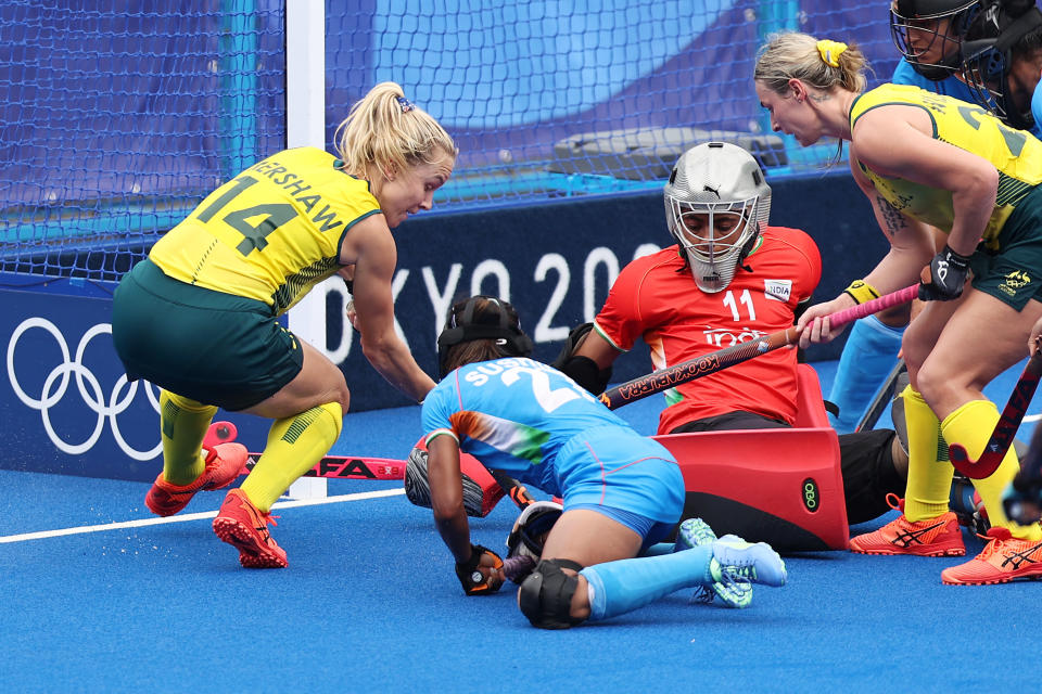 TOKYO, JAPAN - AUGUST 02: Savita and Chanu Pukhrambam Sushila of Team India defend against Stephanie Anna Kershaw of Team Australia during the Women's Quarterfinal match between Australia and India on day ten of the Tokyo 2020 Olympic Games at Oi Hockey Stadium on August 02, 2021 in Tokyo, Japan. (Photo by Buda Mendes/Getty Images)