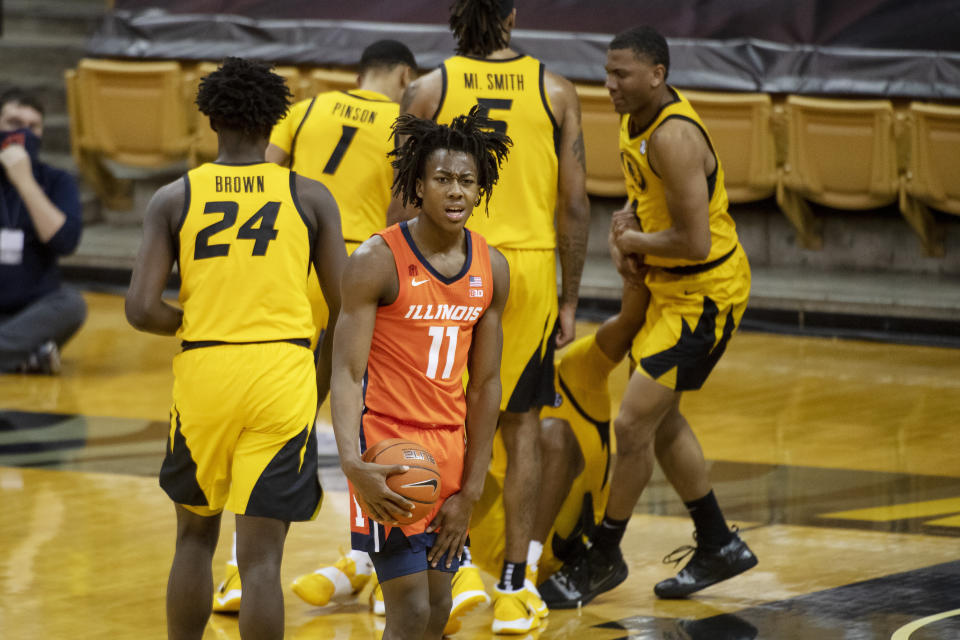 Illinois's Ayo Dosunmu, center, reacts after an offensive foul was called on him during the second half of an NCAA college basketball game against Missouri, Saturday, Dec. 12, 2020, in Columbia, Mo. (AP Photo/L.G. Patterson)