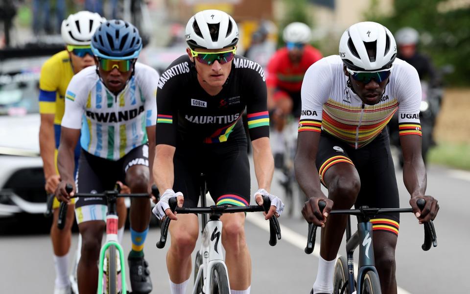 Eric Manizabayo of Team Rwanda, Christopher Rougier-Lagane of Team Mauritius and Charles Kagimu of Team Uganda in the Olympic men's road race.