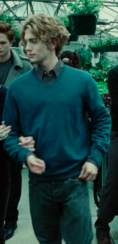 Jasper wearing big jeans, and a button-up shirt under a sweater