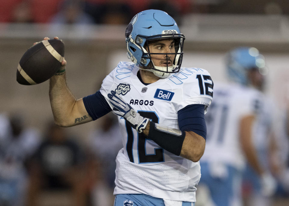 FILE - Toronto Argonauts quarterback Chad Kelly (12) throws against the Montreal Alouettes during the first half of a Canadian Football League game in Montreal, Friday, Sept. 15, 2023. The CFL suspended Toronto Argonauts quarterback Chad Kelly for at least nine regular-season games Tuesday, May 7, 2024, following its investigation into a lawsuit filed by a former strength and conditioning coach against both the player and club.(Christinne Muschi/The Canadian Press via AP, File)