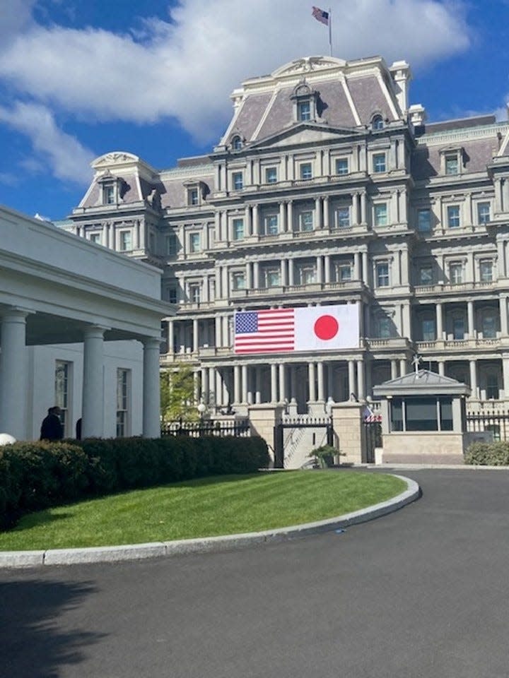 A banner depicting the flags of US and Japan was displayed on the EEOC building, next to the West Wing, a week before the Japanese PM's visit.