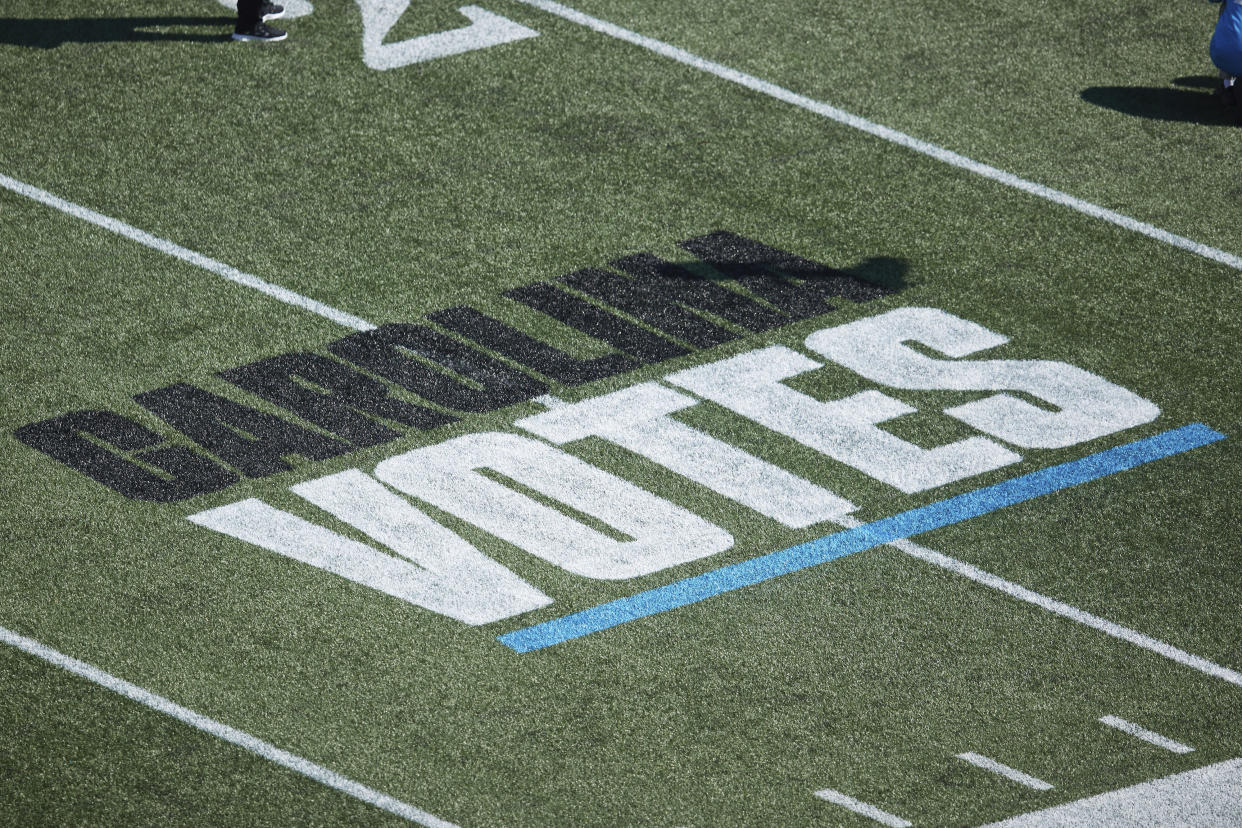 "Carolina Votes" is painted on the field during an NFL game at Bank of America Stadium on Oct. 23, 2022, in Charlotte. (AP Photo/Brian Westerholt)