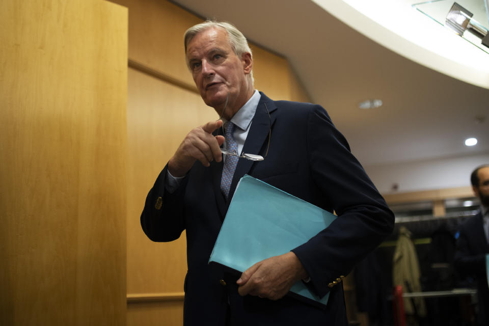 European Union chief Brexit negotiator Michel Barnier arrives to a conference of presidents meeting at the European Parliament in Brussels, Thursday, Sept. 12, 2019. Barnier says the bloc is still waiting for proposals from Prime Minister Boris Johnson to end the impasse in talks over Britain's departure, due at the end of next month. (AP Photo/Francisco Seco)