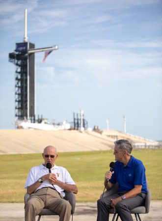 Astronaut Michael Collins speaks with NASA's John F. Kennedy Space Center Director Bob Cabana at Launch Pad 39A at the NASA's John F. Kennedy Space Center on the 50th anniversary of the launch of the Apollo 11 mission to the moon, in Cape Canaveral