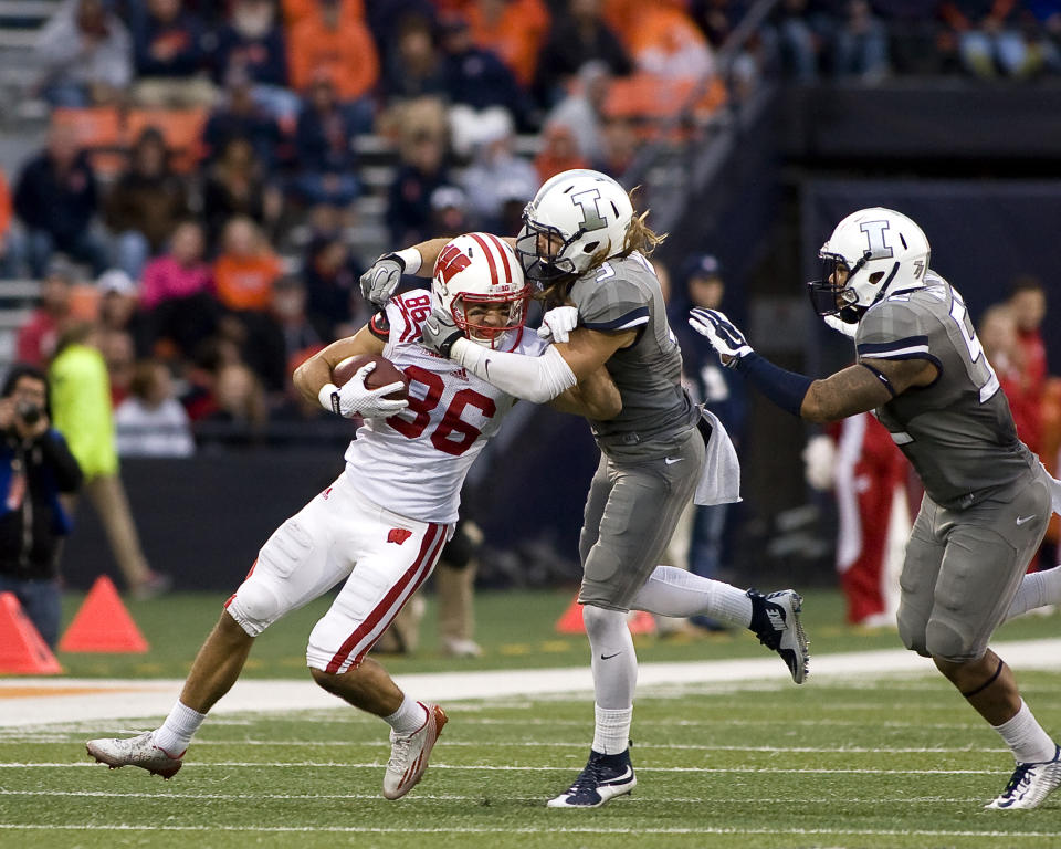 Oct 24, 2015; Champaign, IL, USA; Wisconsin Badgers wide receiver Alex Erickson (86) is tackled by Illinois Fighting Illini defensive back Taylor Barton (3) at Memorial Stadium. Wisconsin beat Illinois 24-13. Mandatory Credit: Mike Granse-USA TODAY Sports