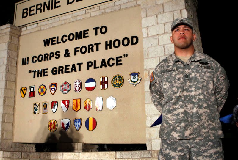 FILE PHOTO: Sgt. First Class Rodriguez stands guard before a news conference at Fort Hood Army Post in Texas