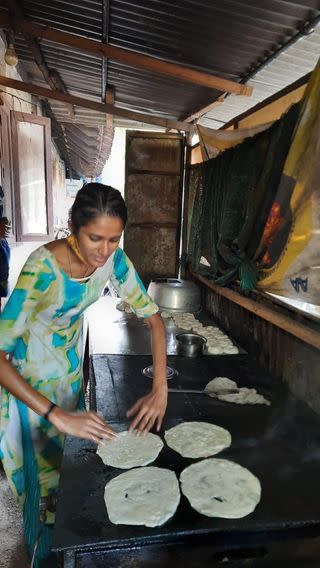 Anaswara Hari cooking parottas on the hot tawa