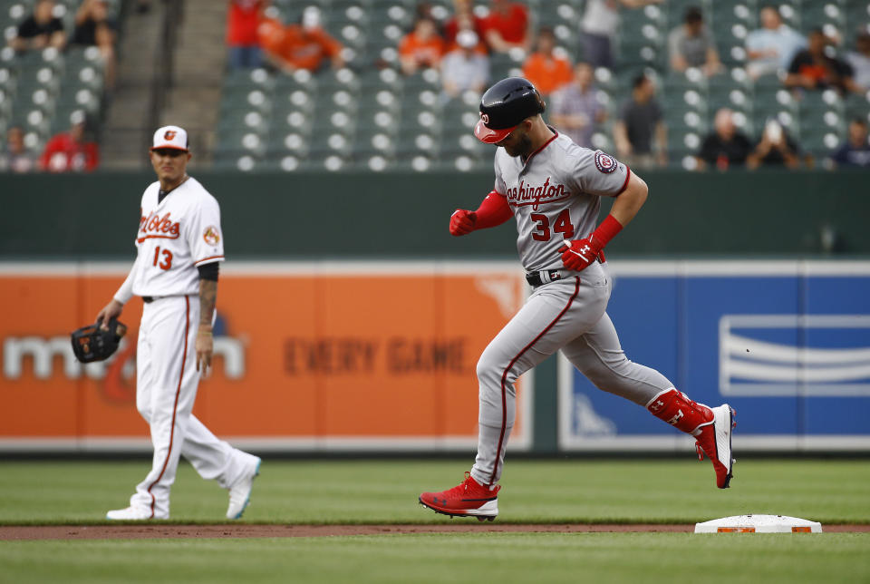 Washington Nationals’ Bryce Harper, right, runs the bases past Baltimore Orioles shortstop Manny Machado after hitting a solo home run during the first inning of a baseball game Tuesday, May 29, 2018, in Baltimore. (AP Photo/Patrick Semansky)