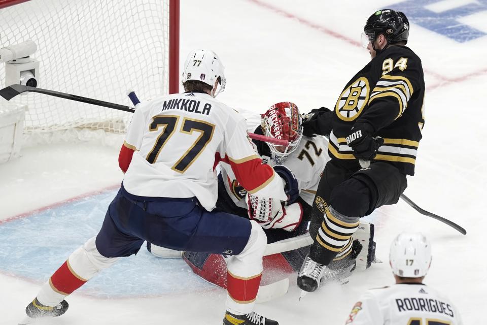 Florida Panthers' Sergei Bobrovsky (72) blocks a shot by Boston Bruins' Jakub Lauko (94) as Niko Mikkola (77) defends during the second period in Game 3 of an NHL hockey Stanley Cup second-round playoff series Friday, May 10, 2024, in Boston. (AP Photo/Michael Dwyer)