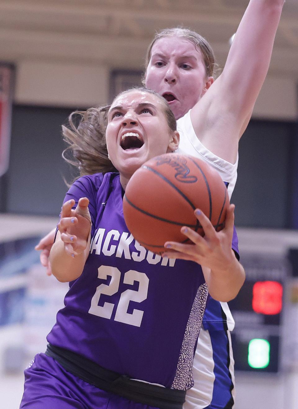 Jackson's Megan Campbell drives to the hoop in the first half against Anthony Wayne's Elise Bender in a Division I regional semifinal, Wednesday, March 6, 2024, at Sandusky High School.