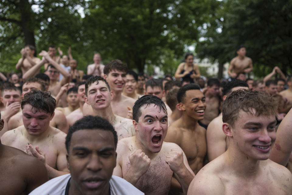 Class of 2027 Plebes celebrate after completing during the Herndon Monument Climb at the U.S. Naval Academy, Wednesday, May 15, 2024, in Annapolis, Md. Freshmen, known as Plebes, participate in the climb to celebrate finishing their first year at the academy. The climb was completed in two hours, nineteen minutes and eleven seconds. (AP Photo/Tom Brenner)